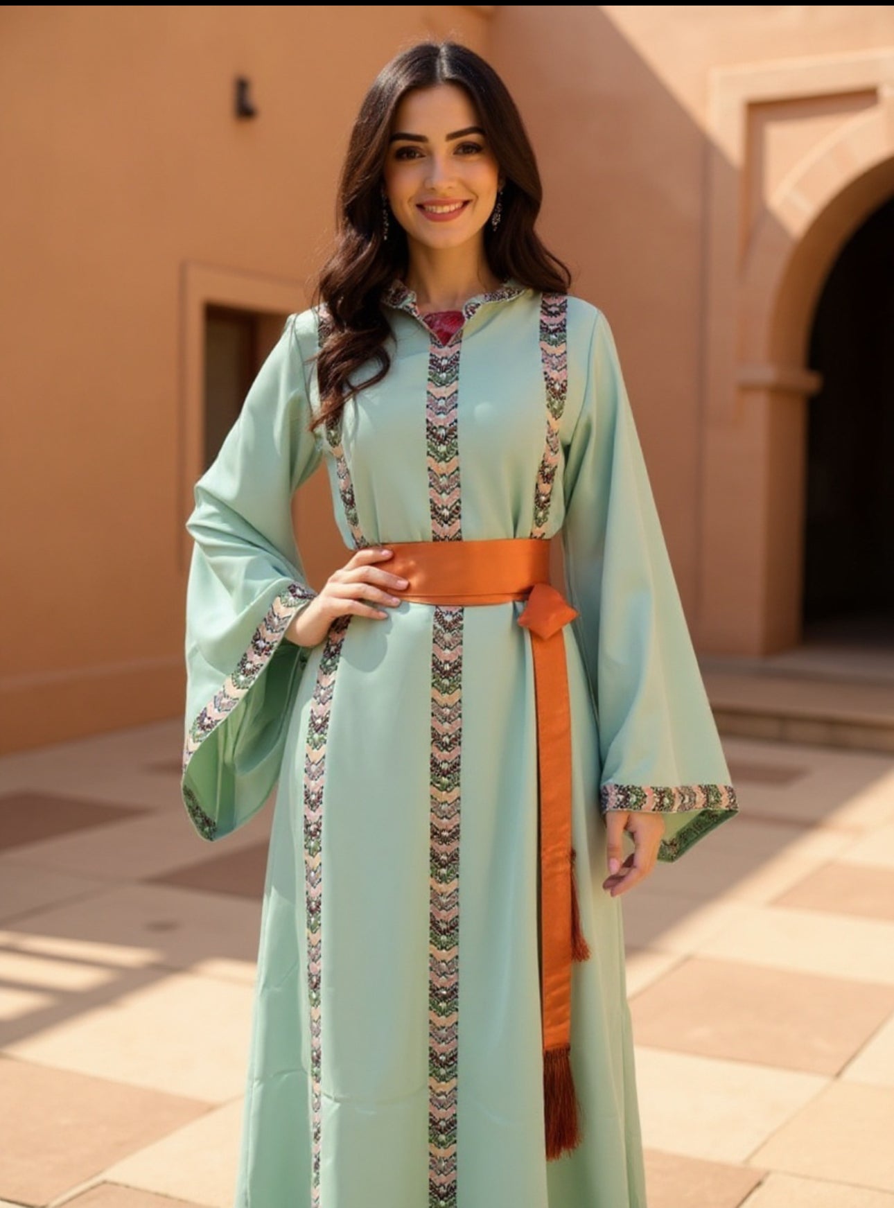 Mint fabric dress with embroidery and satin belt.