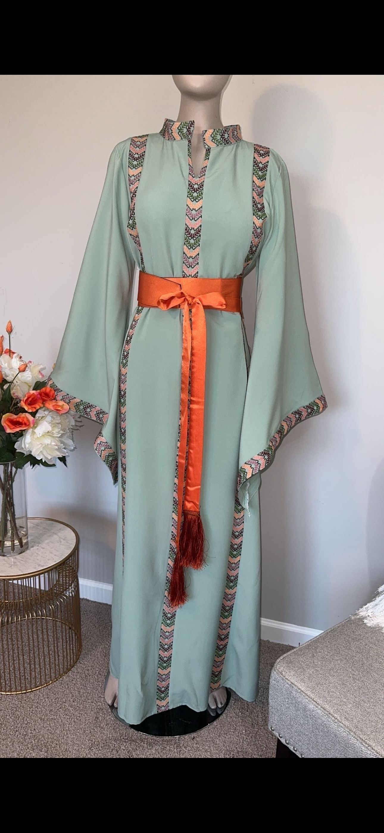 Mint fabric dress with embroidery and satin belt.
