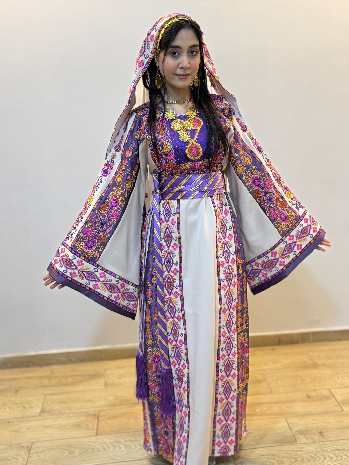 White thobe with purple embroidery