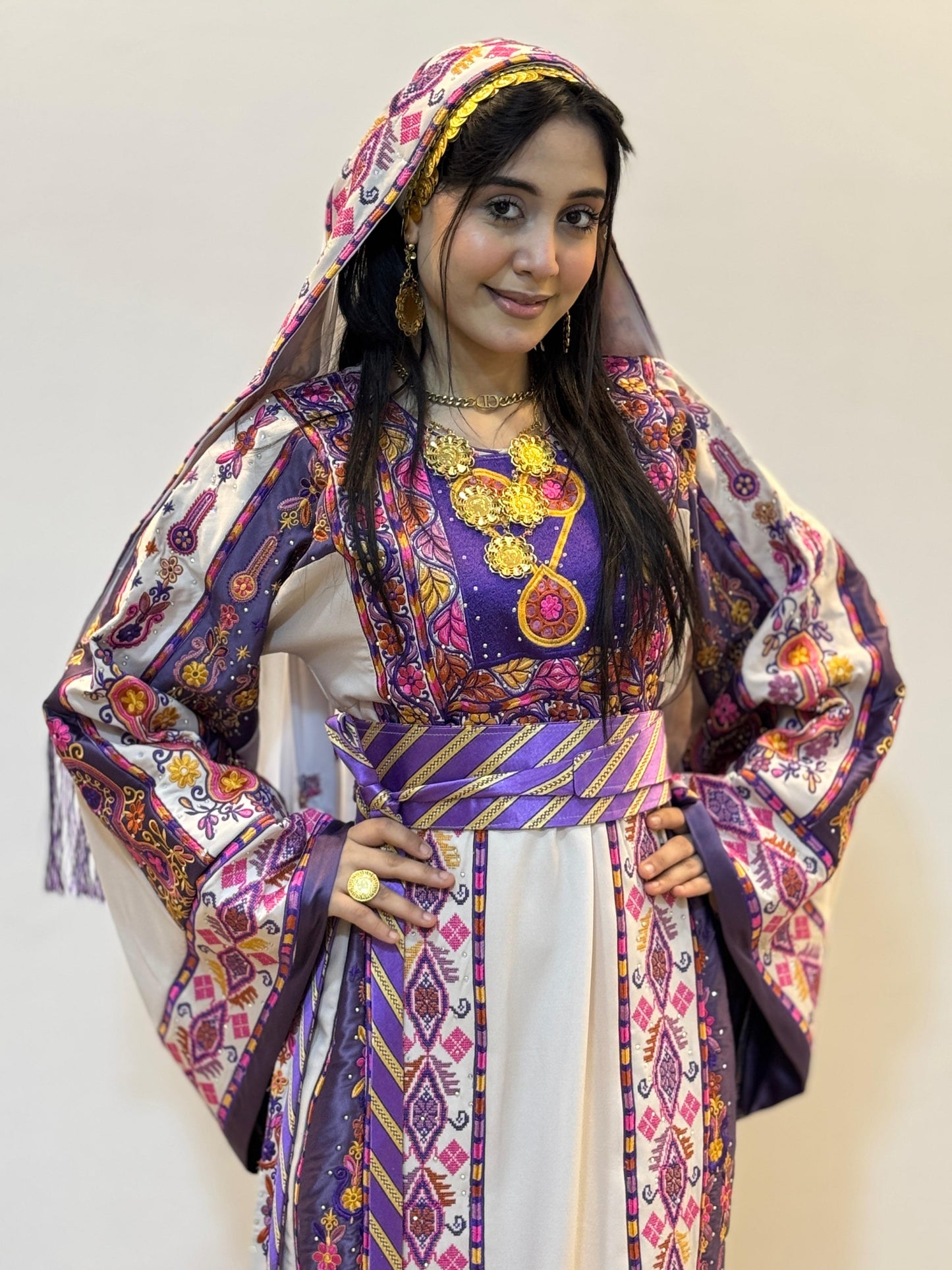 White thobe with purple embroidery