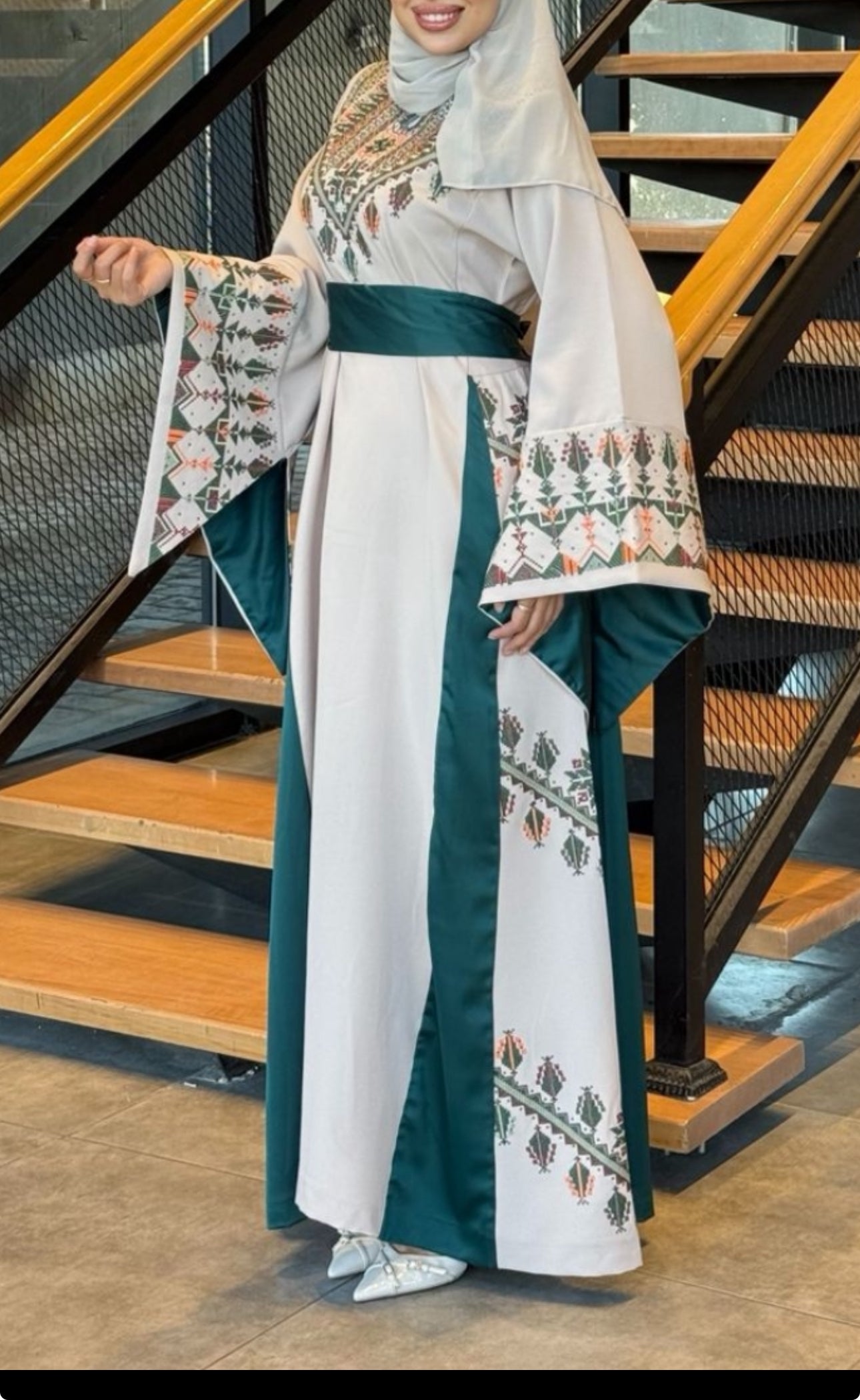 Beige thobe and green fabric