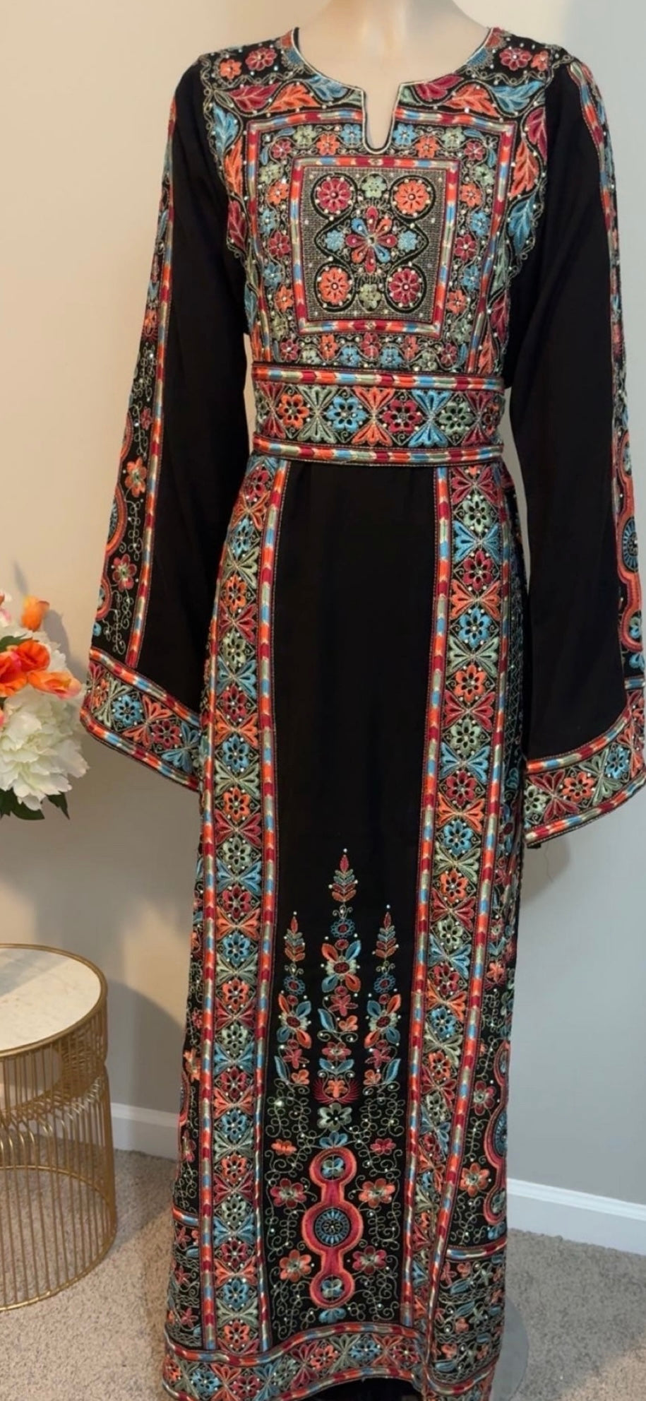 Black thobe with blue and peach embroidery. Matching belt included