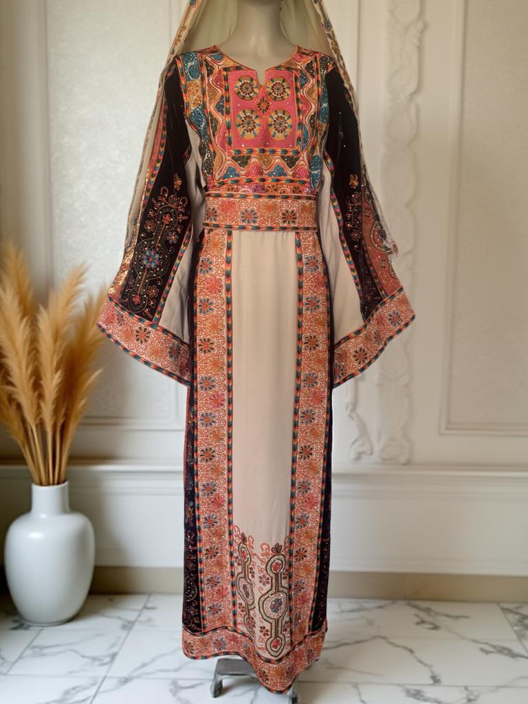 Cream thobe with burgundy velvet and orange satin accents.