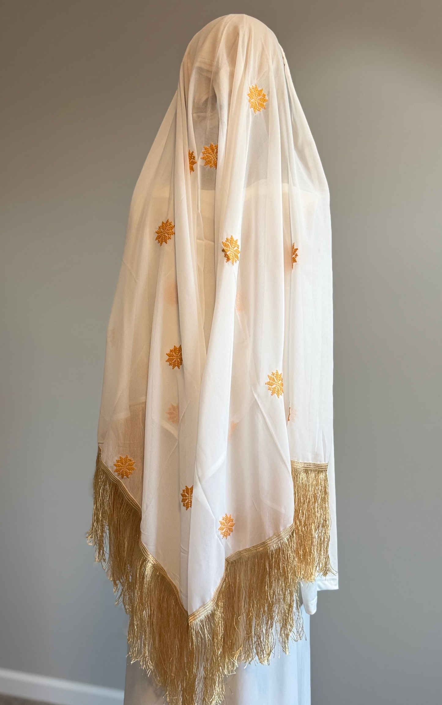 White and gold head scarf