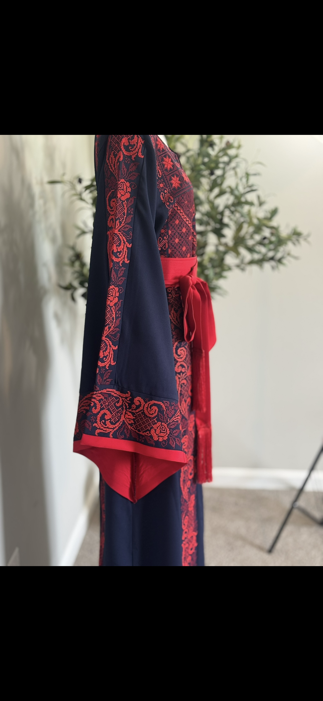 Elegant black and red thobe with matching satin belt