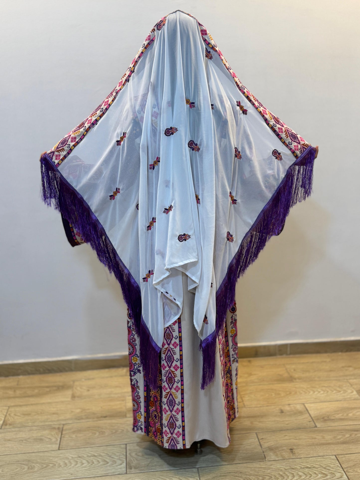 White thobe with purple embroidery
