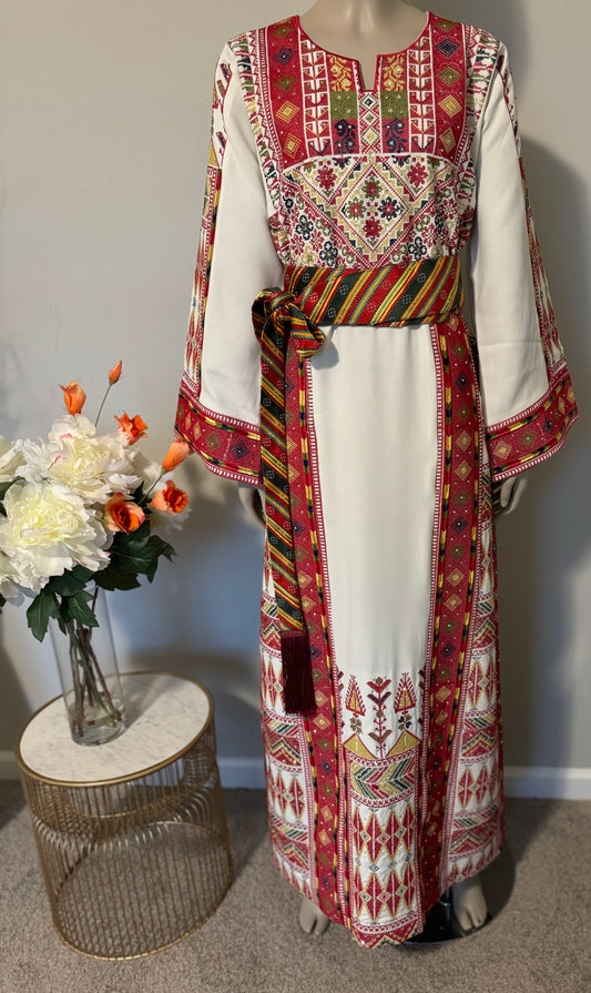 White thobe with colorful embroidery