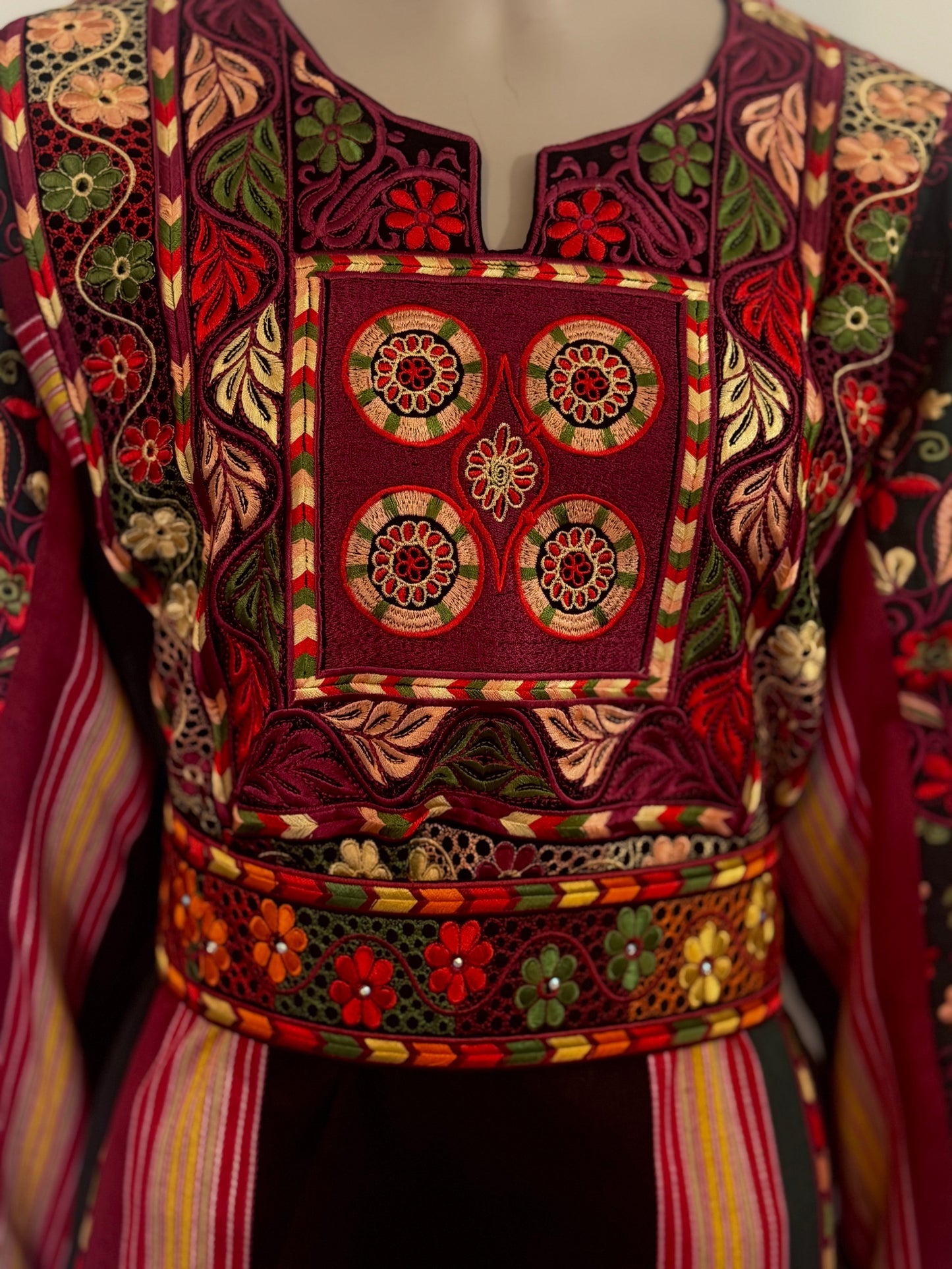 Black majdalwee thobe with orange and green fabric.