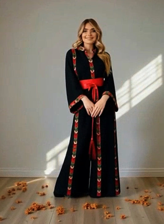 Black dress with embroidery and satin belt.