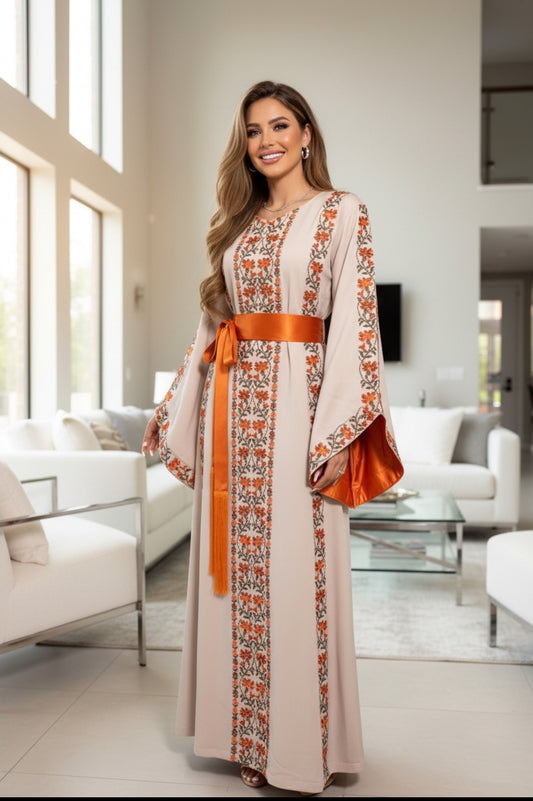 A beautiful beige and orangedress with fashionable sleeves.