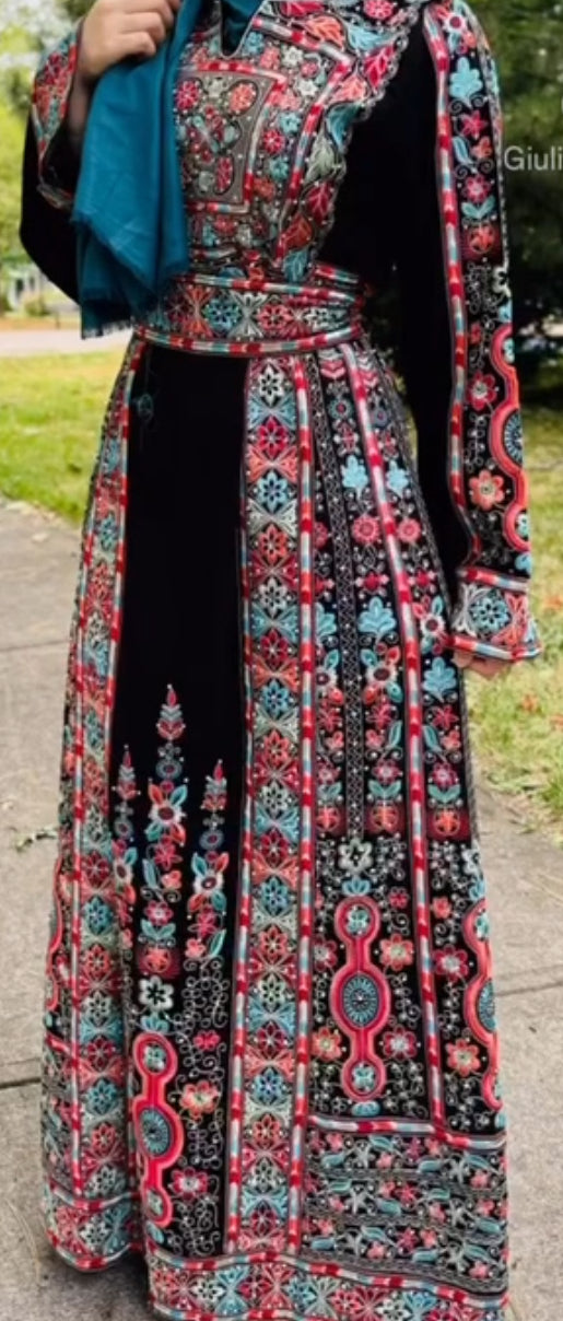 Black thobe with blue and peach embroidery. Matching belt included