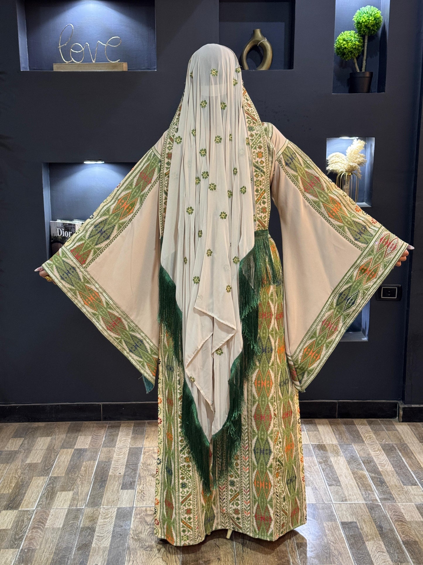 Oof white thobe with green embroidered