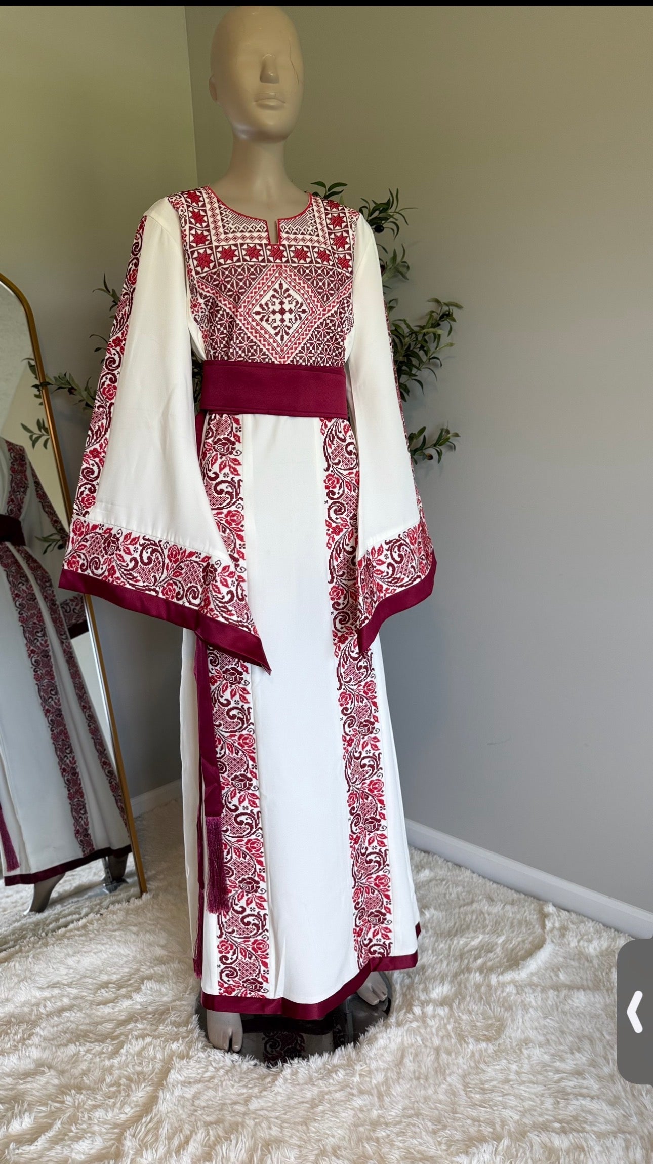 Traditional white, burgundy, and red embroidered thobe
