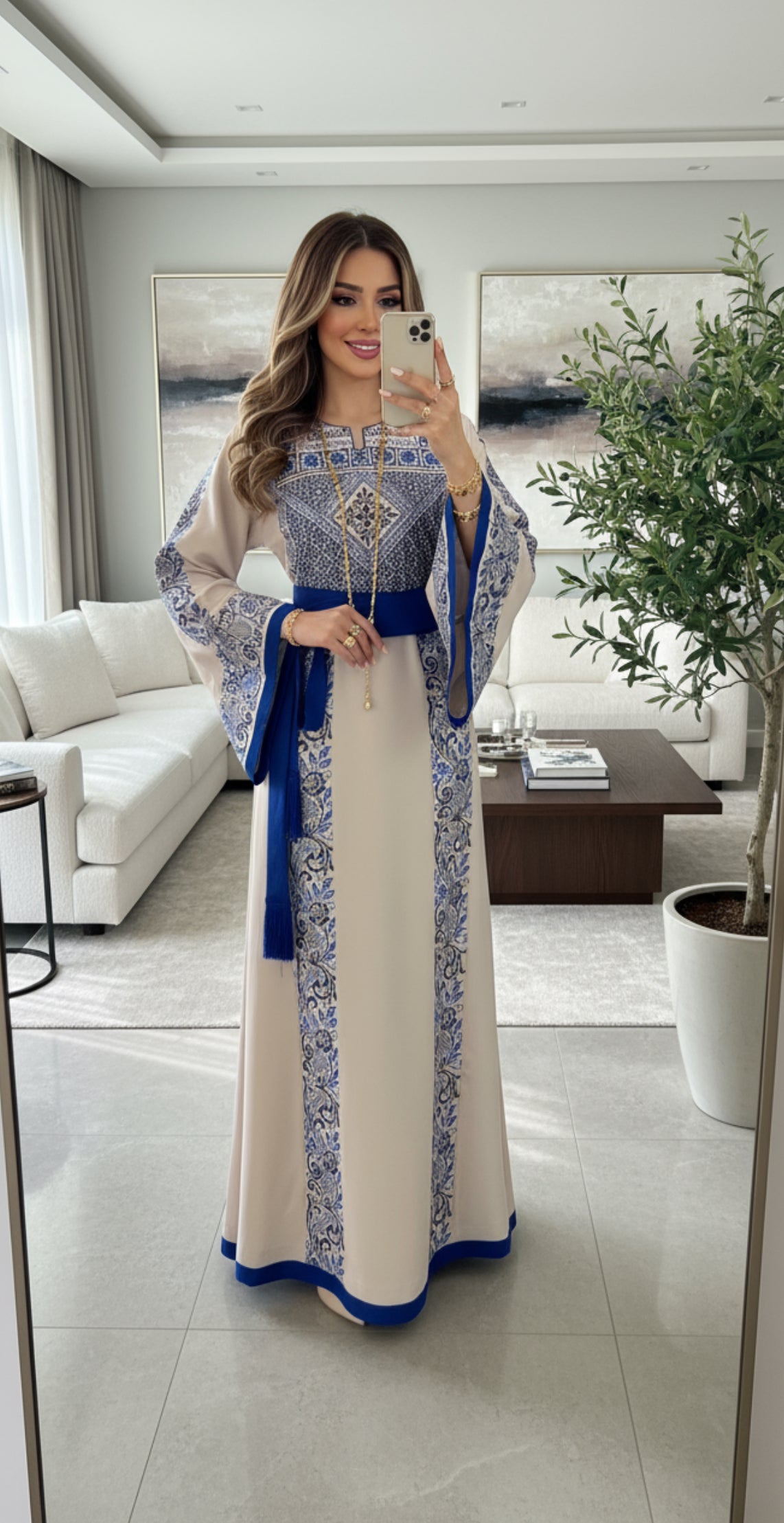 Beige thobe with royal blue embroidery and matching satin belt