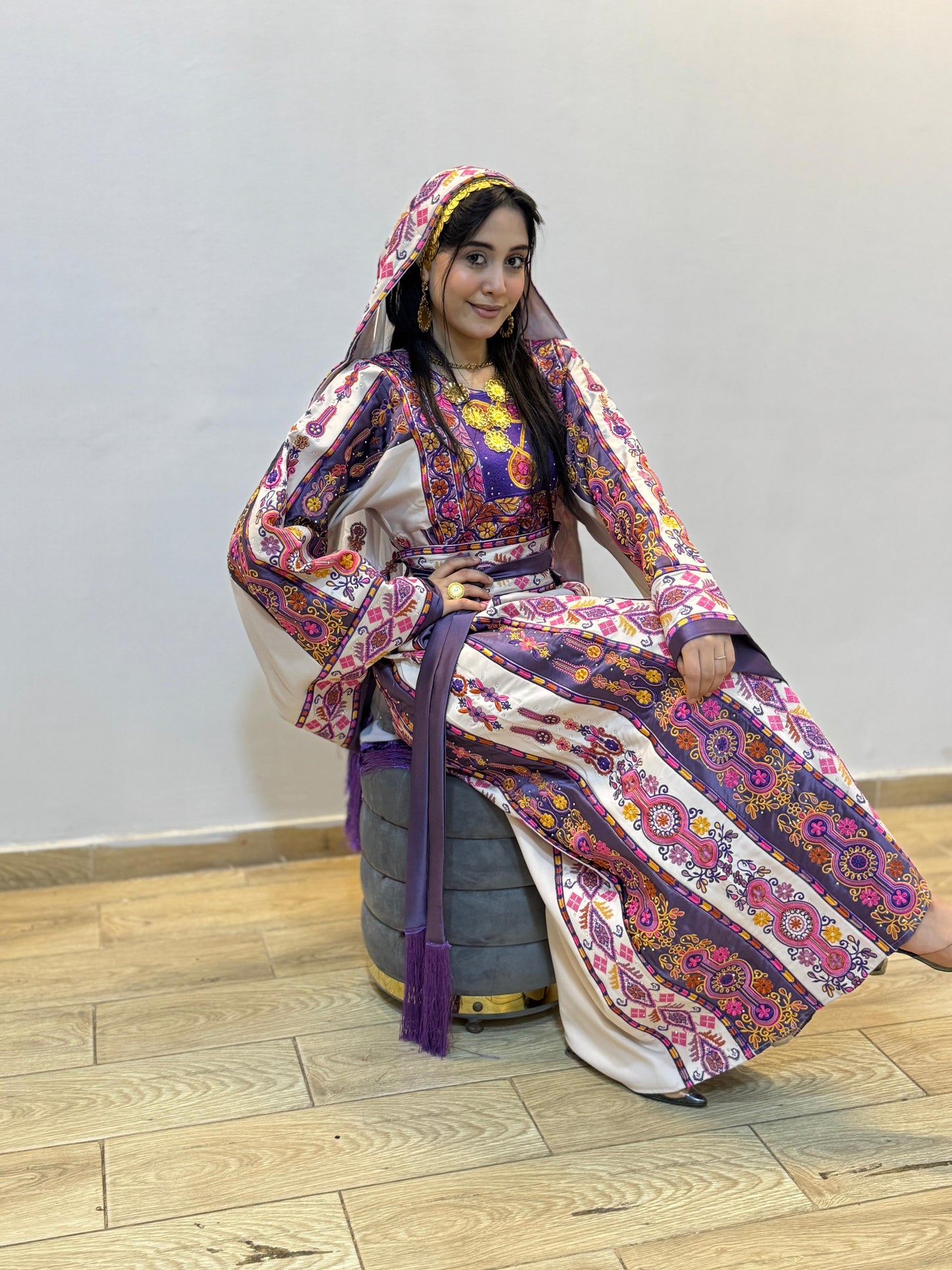 White thobe with purple embroidery