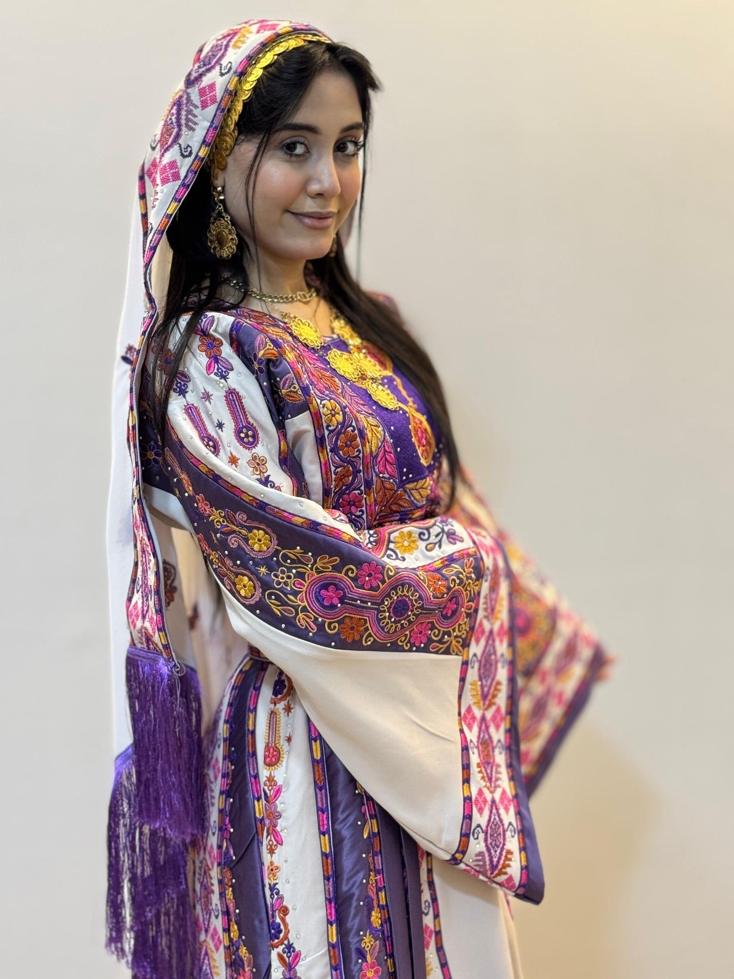 White thobe with purple embroidery