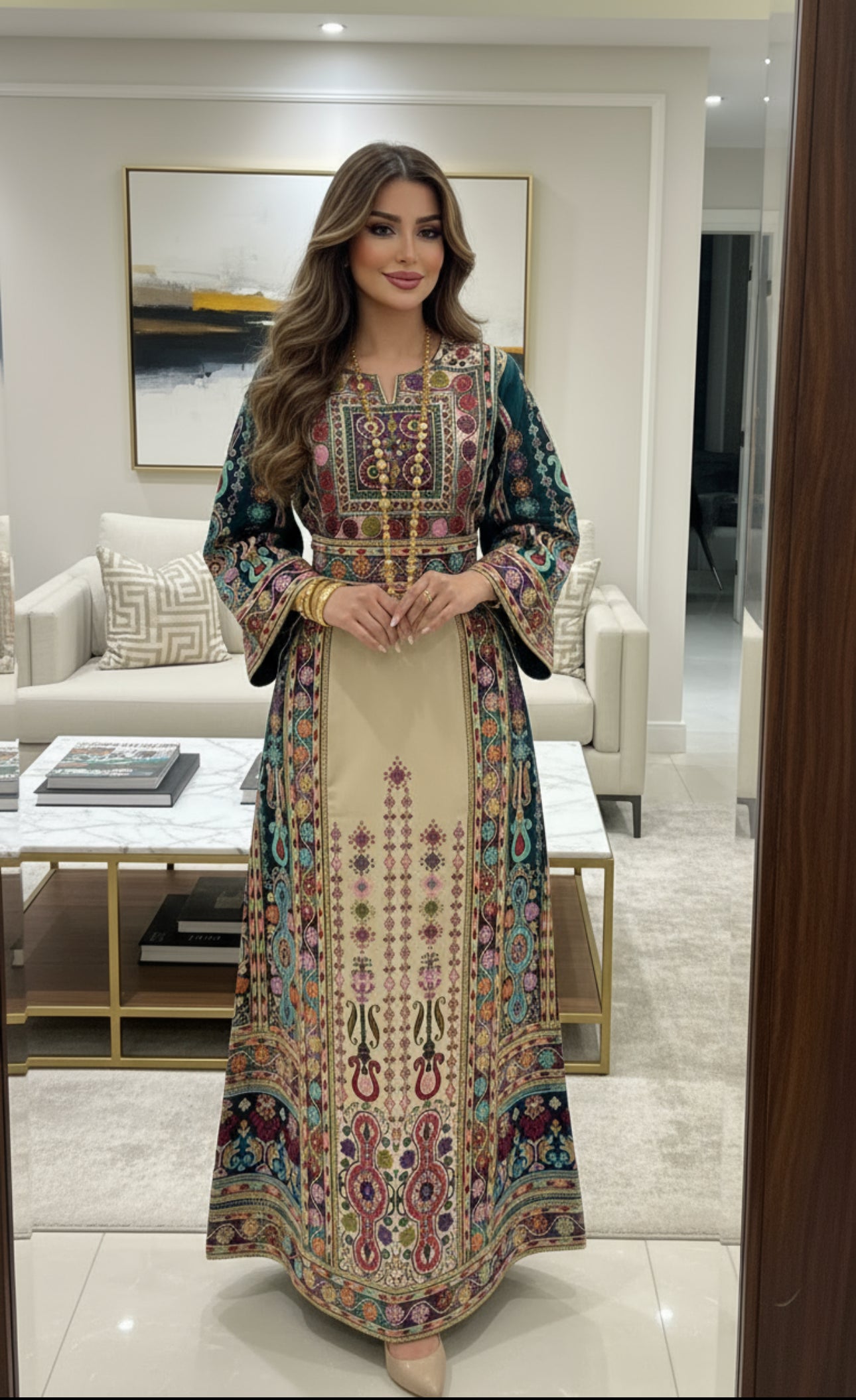 Light beige thobe with green fabric and colorful embroidery.