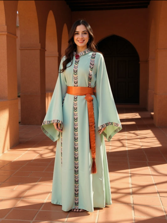 Mint fabric dress with embroidery and satin belt.