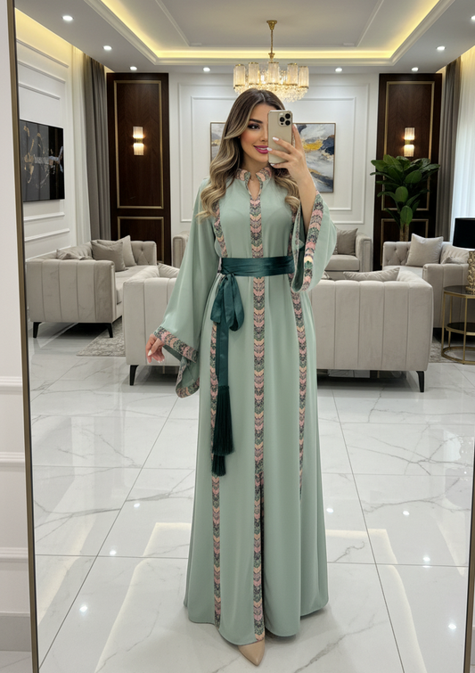 Mint fabric dress with embroidery and satin belt.